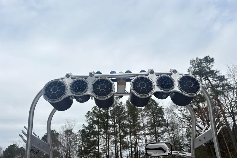 Slide: The Image of Tower speakers on a 2005 Correct Craft Nautique boat against a cloudy sky. - 11