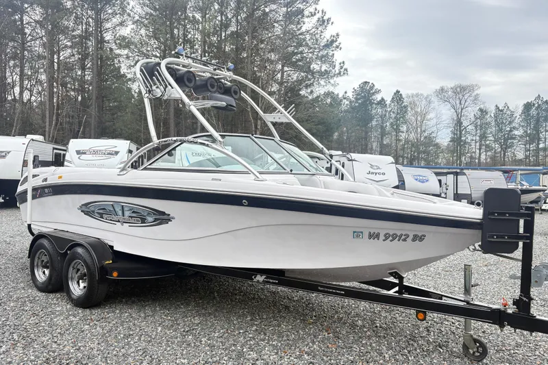 Slide: The Image of 2005 Correct Craft Nautique boat on trailer in outdoor setting. - 4