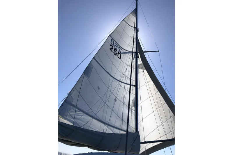 Slide: The Image of Sailboat Endeavour 40 CC 1984 with sails unfurled against a clear blue sky. - 1