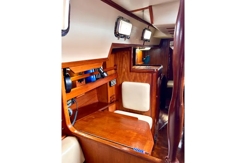 Slide: The Image of Interior of 1984 Endeavour 40 CC sailboat with wooden furnishings and seating. - 15