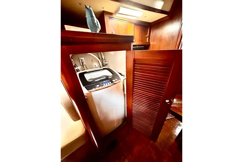 Slide: The Image of Compact washing machine in wooden cabinet aboard 1984 Endeavour 40 CC sailboat. - 18