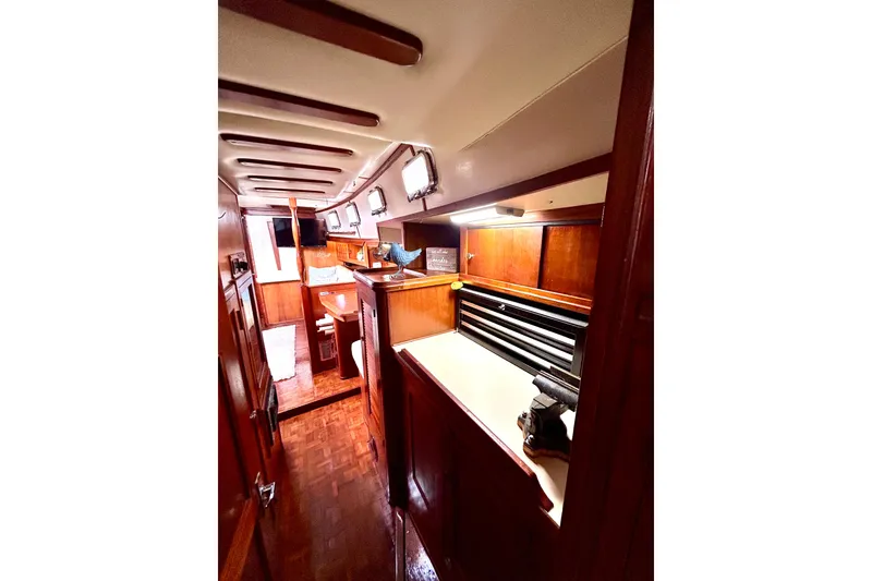 Slide: The Image of Interior of 1984 Endeavour 40 CC sailboat with wooden cabinetry and cozy layout. - 22