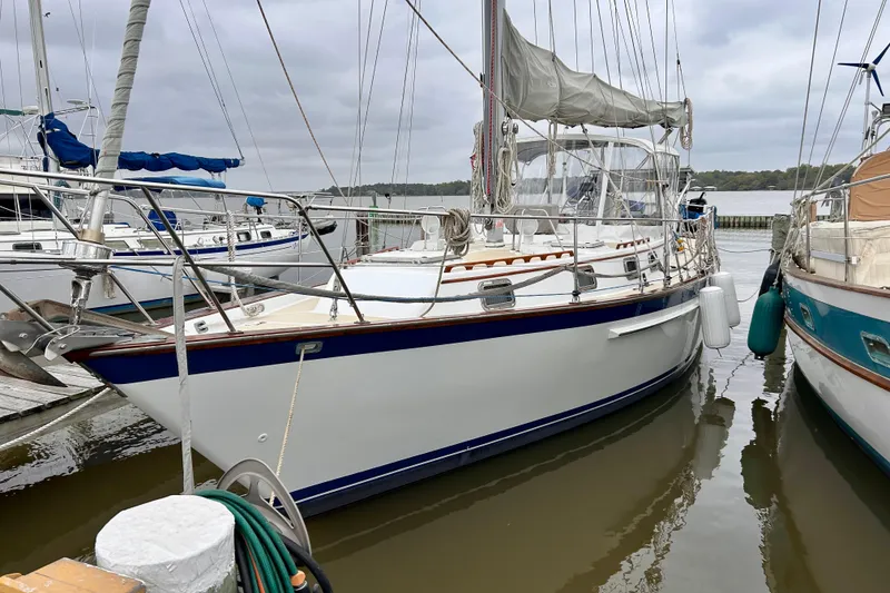 Slide: The Image of 1984 Endeavour 40 CC sailboat docked at marina, overcast sky. - 7
