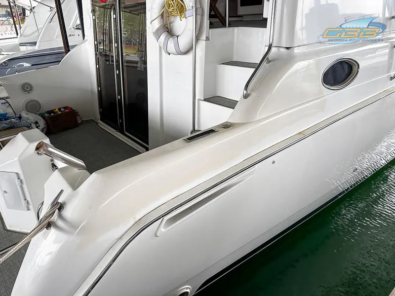 Slide: The Image of 1996 Silverton 442 Cockpit Motor Yacht at dock. - 11