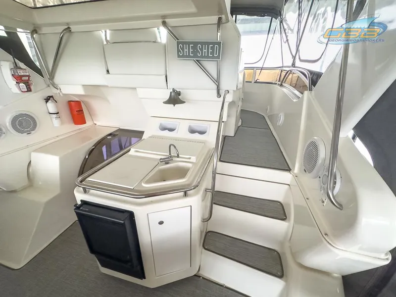 Slide: The Image of Interior of 1996 Silverton 442 Cockpit Motor Yacht with kitchenette. - 19