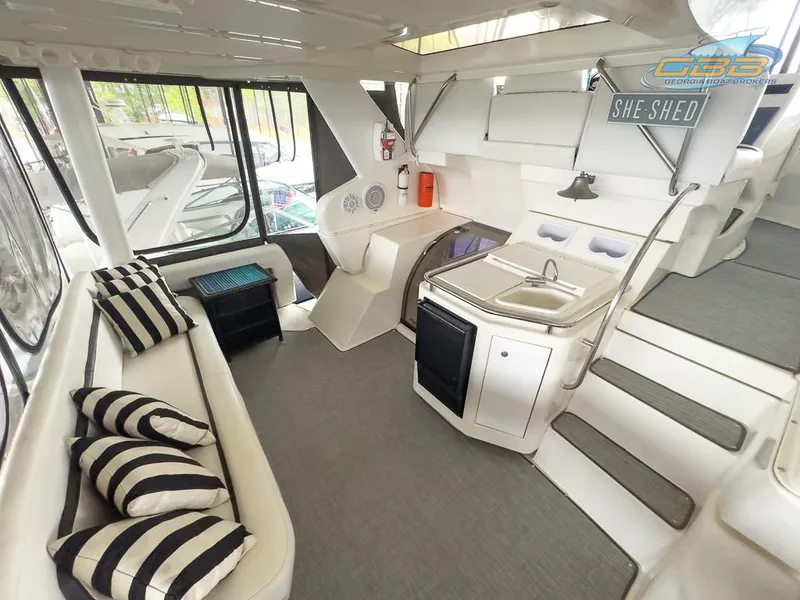 Slide: The Image of Interior of 1996 Silverton 442 Cockpit Motor Yacht with modern amenities. - 20