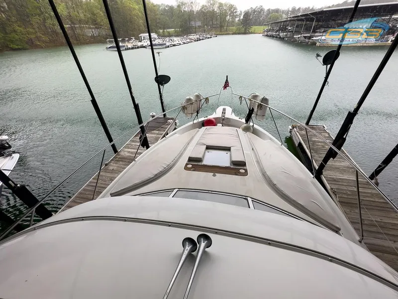 Slide: The Image of 1996 Silverton 442 Cockpit Motor Yacht docked at marina. - 25