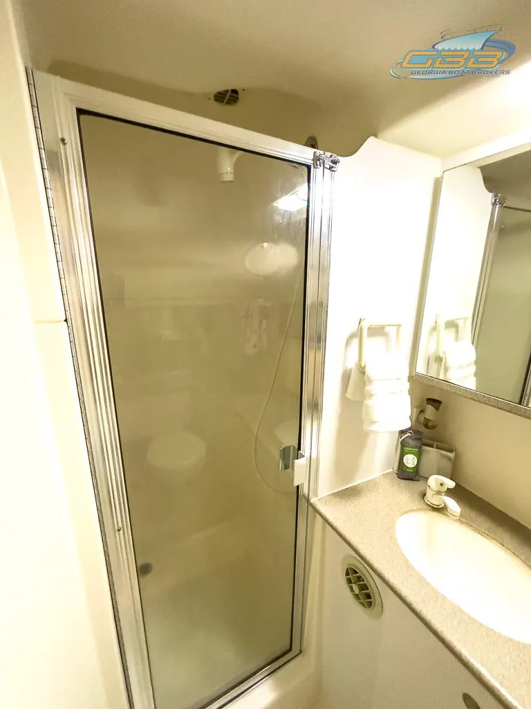 Slide: The Image of Bathroom of 1996 Silverton 442 Cockpit Motor Yacht with shower and sink. - 27