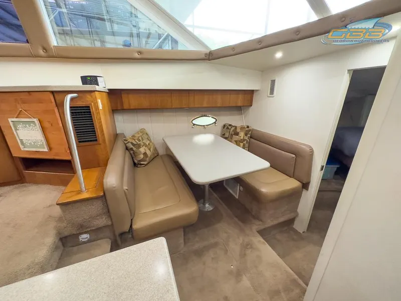 Slide: The Image of Interior of 1996 Silverton 442 Cockpit Motor Yacht with dining area. - 34
