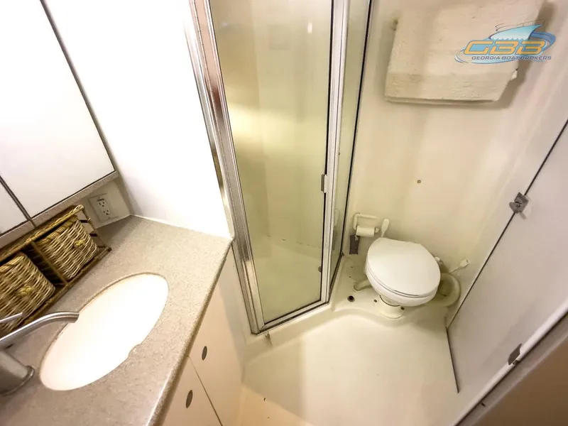 Slide: The Image of 1996 Silverton 442 Cockpit Motor Yacht bathroom with shower and toilet. - 36