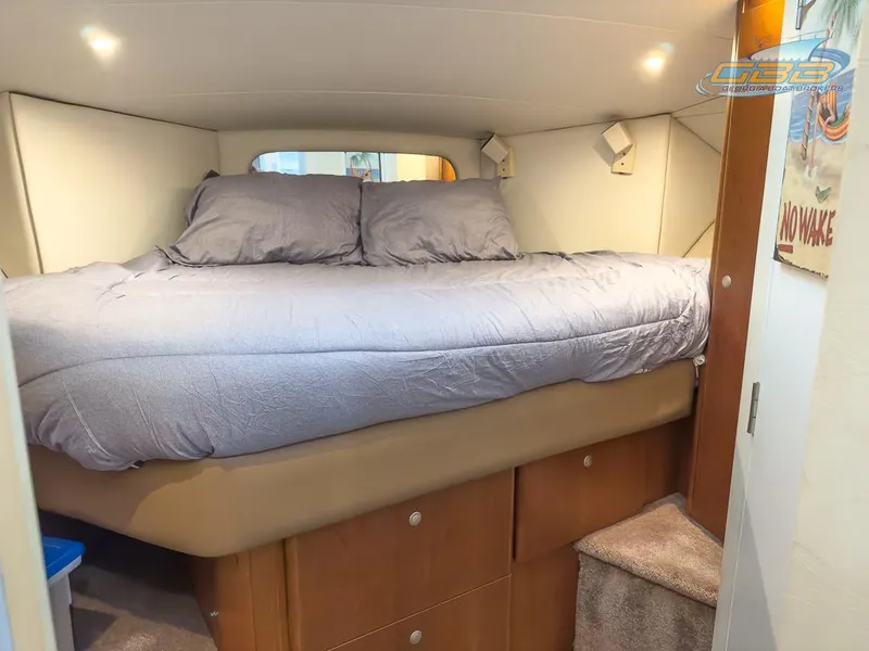 Slide: The Image of Interior of 1996 Silverton 442 Cockpit Motor Yacht with cozy bed. - 38