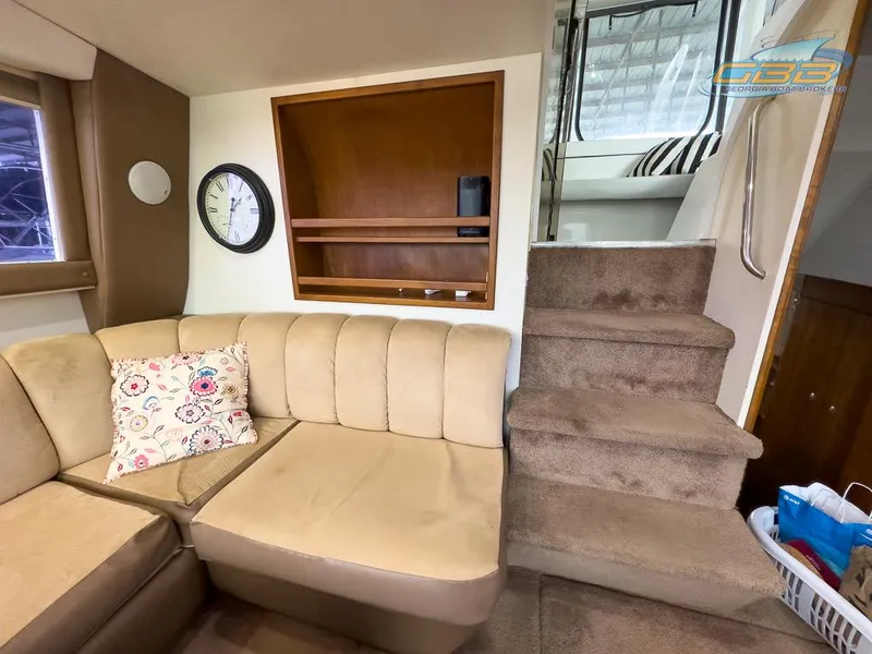 Slide: The Image of Interior of 1996 Silverton 442 Cockpit Motor Yacht with sofa and stairs. - 39