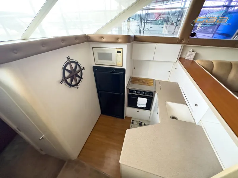 Slide: The Image of Interior of Silverton 442 Cockpit Motor Yacht, kitchen with appliances, year 1996. - 44
