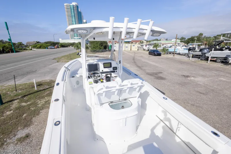 Slide: The Image of 2014 Sea Hunt Gamefish 25 boat with center console and modern navigation equipment. - 10
