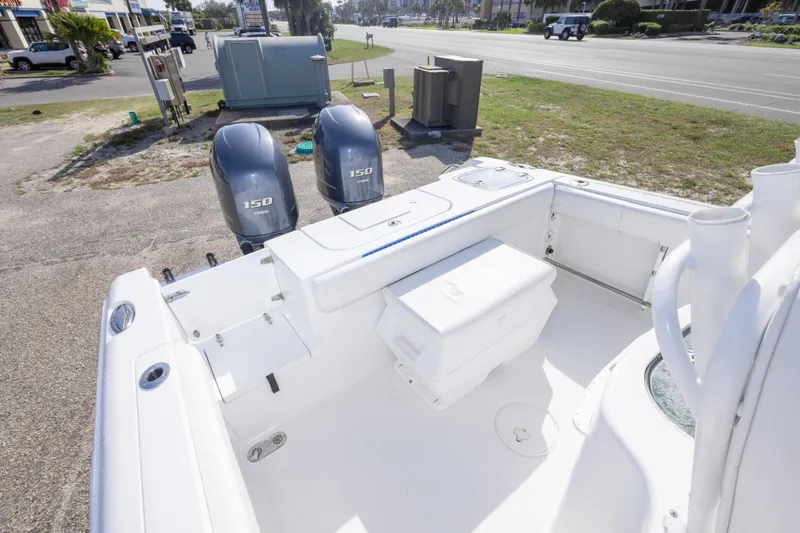 Slide: The Image of 2014 Sea Hunt Gamefish 25 boat with dual Yamaha 150 engines, parked on a lot. - 13