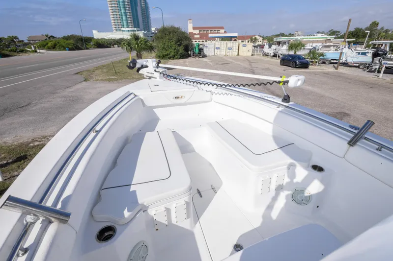 Slide: The Image of 2014 Sea Hunt Gamefish 25 boat interior with seating and fishing equipment. - 23