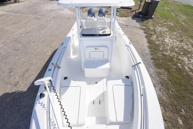 Slide: The Image of 2014 Sea Hunt Gamefish 25 boat, white interior, spacious deck, dual seats, and modern design. - 26