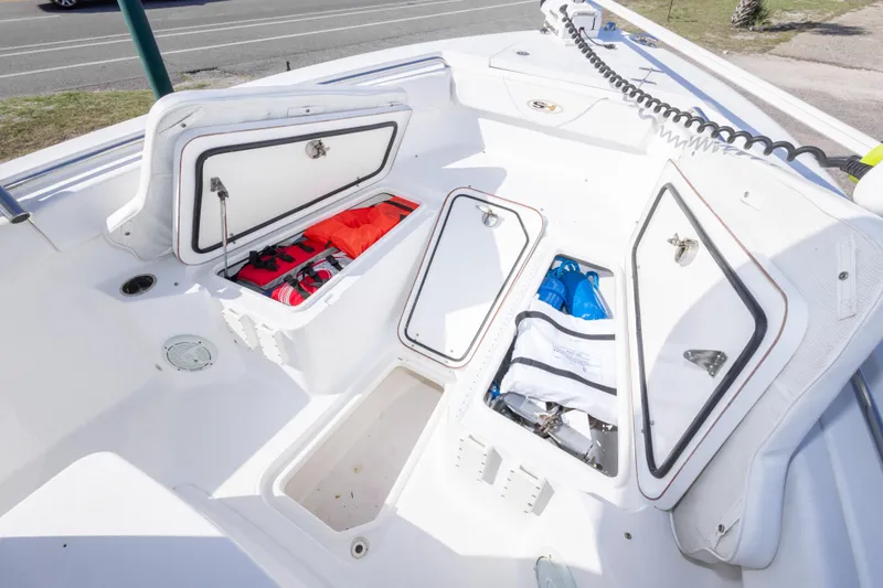 Slide: The Image of 2014 Sea Hunt Gamefish 25 boat storage compartments with safety gear and equipment. - 28