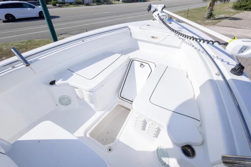 Slide: The Image of 2014 Sea Hunt Gamefish 25 boat interior with seating and storage compartments. - 29