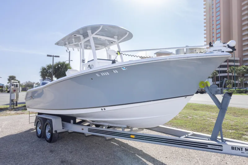 Slide: The Image of 2014 Sea Hunt Gamefish 25 boat on trailer, parked outdoors near buildings. - 4