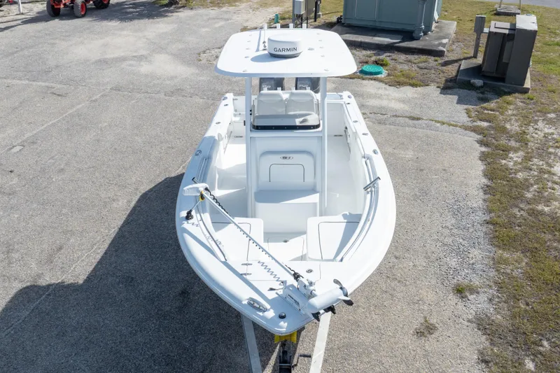 Slide: The Image of 2014 Sea Hunt Gamefish 25 boat with Garmin equipment, parked on concrete. - 41