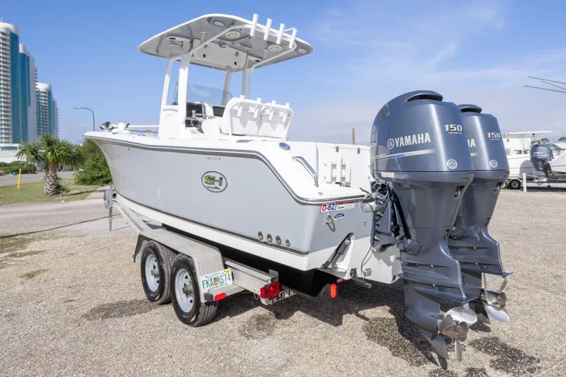 Slide: The Image of 2014 Sea Hunt Gamefish 25 boat with dual Yamaha 150 engines on trailer. - 6
