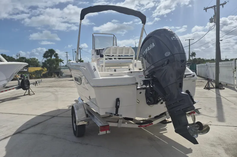 Slide: The Image of 2026 Robalo R180 Center Console boat with Yamaha engine on trailer. - 15