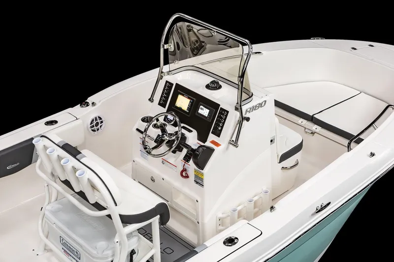 Slide: The Image of Manufacturer Provided Image: 2025 Robalo R180 Center Console boat interior with steering wheel and seating. - 8