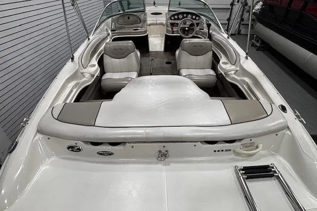 Slide: The Image of 2002 Sea Ray 182 Bow Rider interior with white seating and dashboard view. - 27