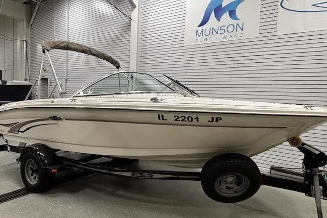 Slide: The Image of 2002 Sea Ray 182 Bow Rider boat on trailer in showroom. - 3