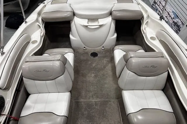 Slide: The Image of Interior of a 2002 Sea Ray 182 Bow Rider boat with cushioned seating. - 32