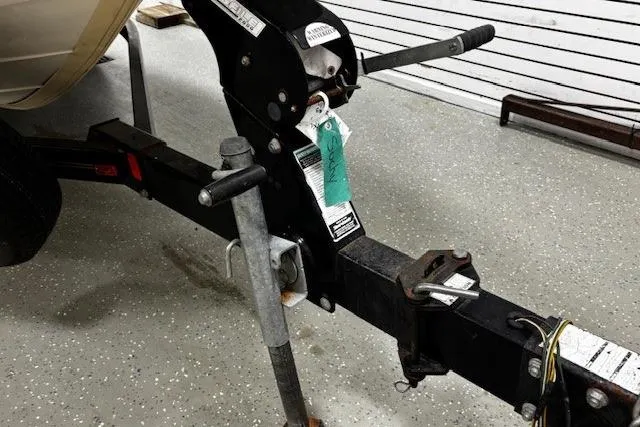 Slide: The Image of Trailer hitch of a 2002 Sea Ray 182 Bow Rider boat in a garage. - 36