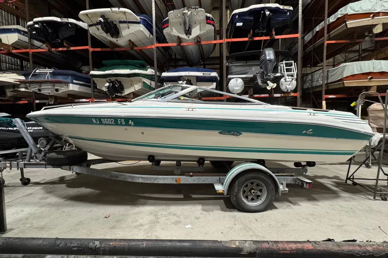 The Image of 1991 Sea Ray 185 Bow Rider on trailer in indoor storage facility. - 1