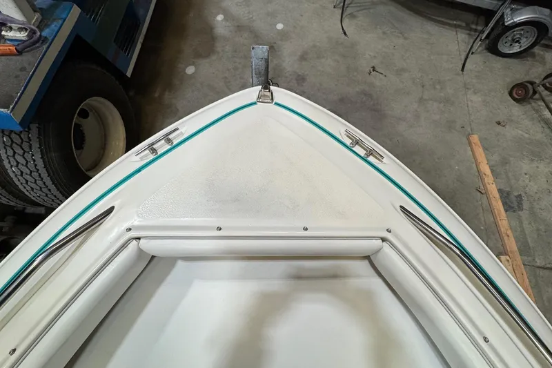Slide: The Image of 1991 Sea Ray 185 Bow Rider boat bow in a garage setting. - 11