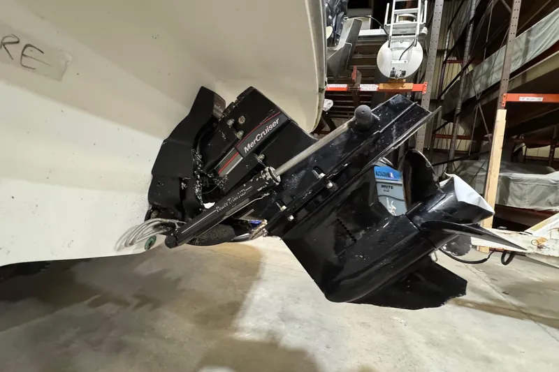Slide: The Image of 1991 Sea Ray 185 Bow Rider with MerCruiser engine in storage facility. - 13