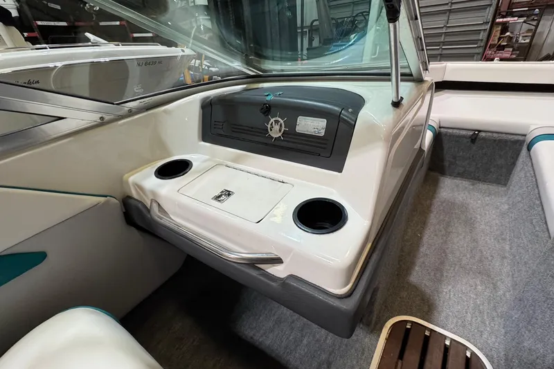 Slide: The Image of 1991 Sea Ray 185 Bow Rider interior with dashboard and seating area. - 6