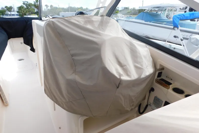 Slide: The Image of 2015 Grady-White Freedom 307 boat interior with covered helm station. - 12