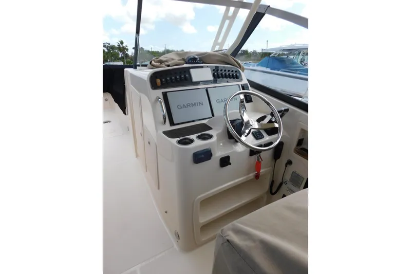 Slide: The Image of 2015 Grady-White Freedom 307 boat helm with Garmin navigation system. - 14