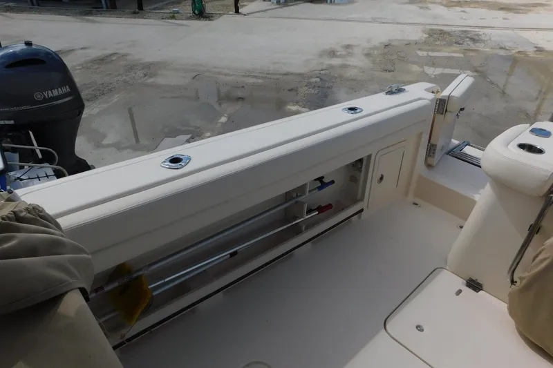 Slide: The Image of 2015 Grady-White Freedom 307 boat interior with Yamaha engine visible. - 20