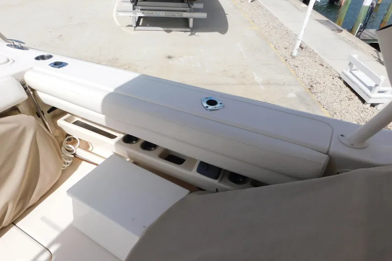 Slide: The Image of Interior view of a 2015 Grady-White Freedom 307 boat, showcasing seating and storage. - 21