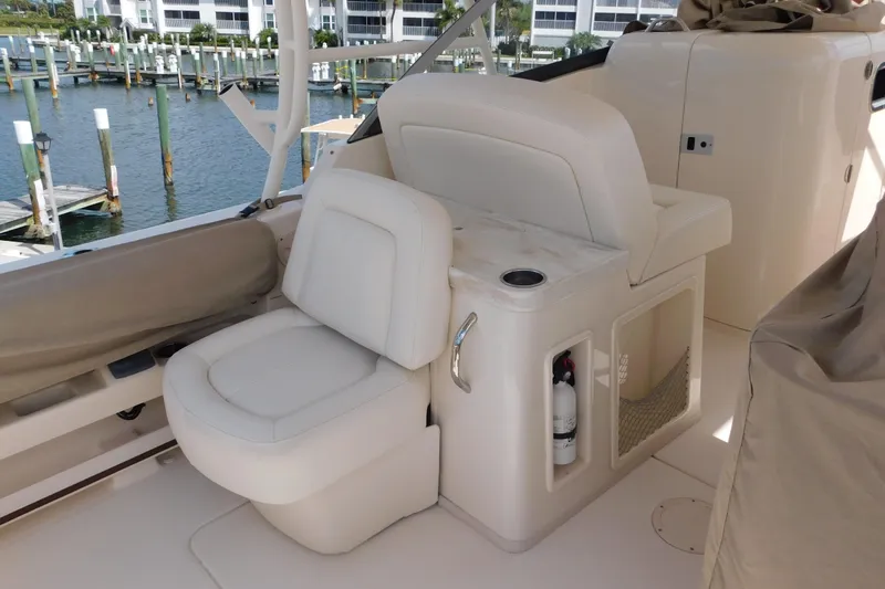 Slide: The Image of 2015 Grady-White Freedom 307 boat interior with seating and storage. - 22