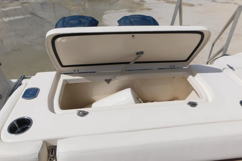 Slide: The Image of Open storage compartment on a 2015 Grady-White Freedom 307 boat. - 24
