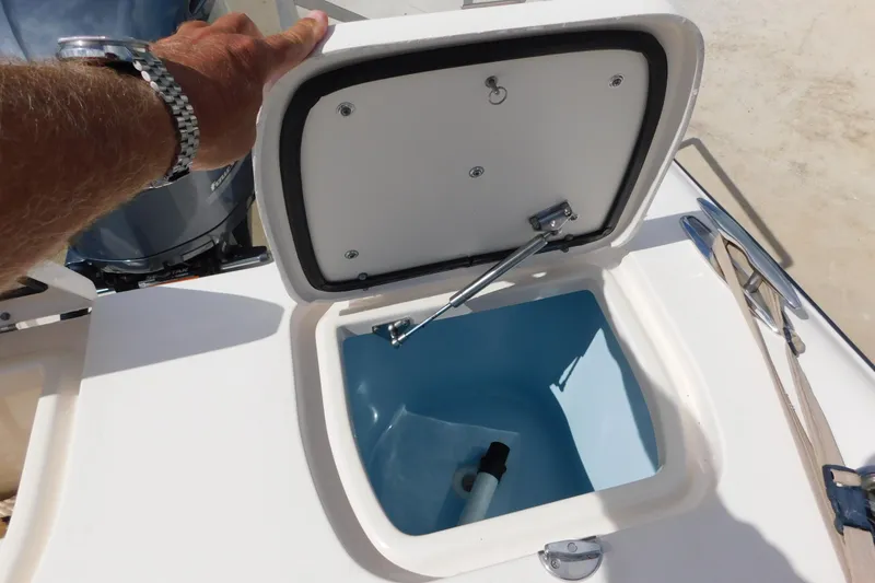 Slide: The Image of Open storage compartment on a 2015 Grady-White Freedom 307 boat. - 25