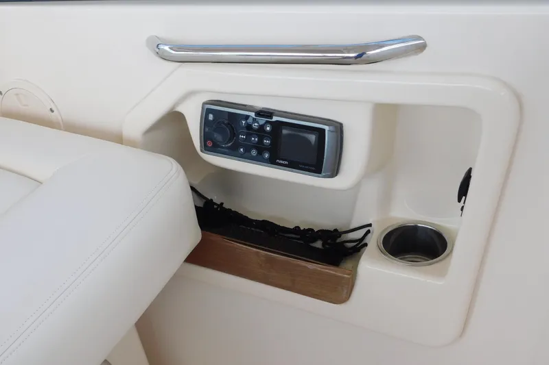 Slide: The Image of 2015 Grady-White Freedom 307 boat interior with control panel and cup holder. - 28