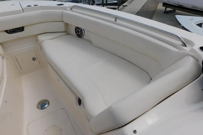 Slide: The Image of 2015 Grady-White Freedom 307 boat interior with white cushioned seating. - 35