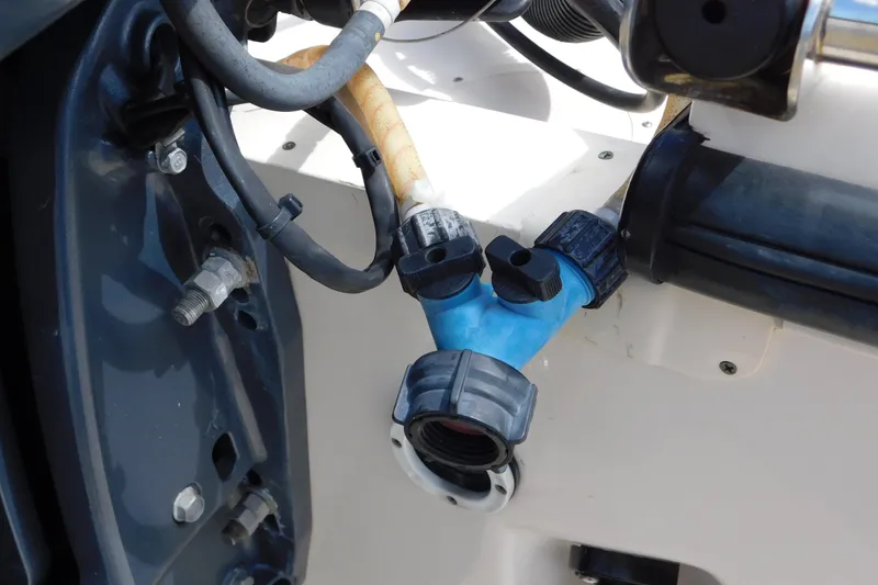 Slide: The Image of Close-up of 2015 Grady-White Freedom 307 boat's engine connections and fittings. - 41