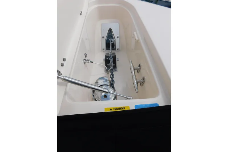 Slide: The Image of Anchor compartment of 2015 Grady-White Freedom 307 boat with chain and cleats. - 42