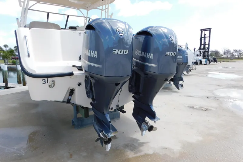 Slide: The Image of 2015 Grady-White Freedom 307 boat with twin Yamaha 300 outboard engines. - 7
