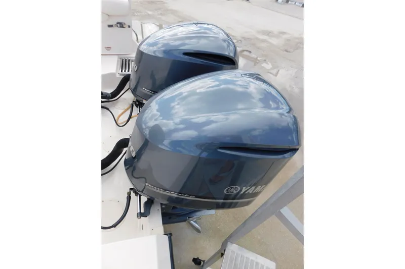 Slide: The Image of Twin Yamaha outboard engines on a 2015 Grady-White Freedom 307 boat. - 8