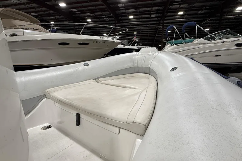 Slide: The Image of 2013 Mercury 560 inflatable boat interior in a marina with other boats. - 8